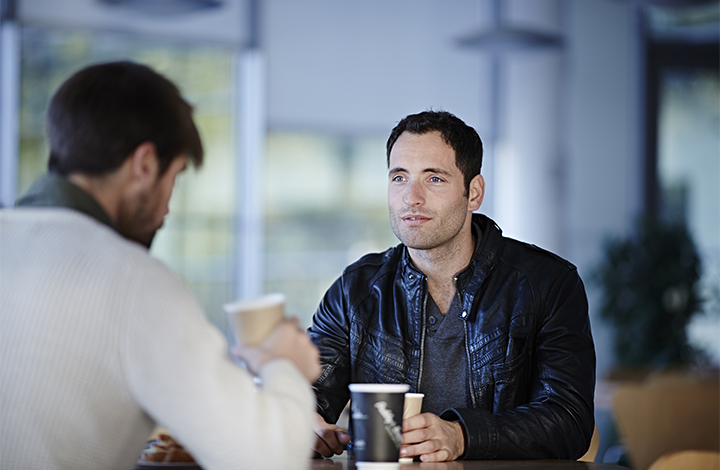 men having coffee in cafe